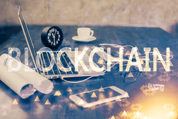 Double exposure of blockchain and crypto economy theme hologram and table with computer background....