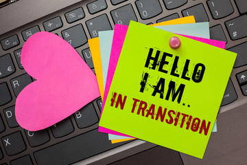 Text sign showing Hello I Am.. In Transition. Conceptual photo Changing process Progressing planning new things Bright colorful written papers pinch by pin pink heart on computer keyboard