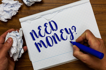 Conceptual hand writing showing Need Money question. Business photo showcasing asking someone if he needs cash or bouns Get loan Man holding marker notebook crumpled papers ripped pages