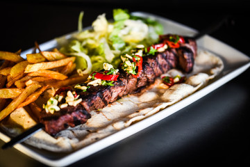 beef skewer with french fries & mix salad