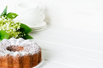 Bundt cake with sugar frosting. Spring breakfast set. Morning tea Selected focus. Copy space