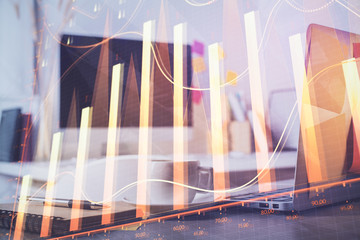 Stock market graph and table with computer background. Double exposure. Concept of financial analysis.