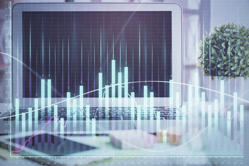 Forex market chart hologram and personal computer background. Double exposure. Concept of investment.