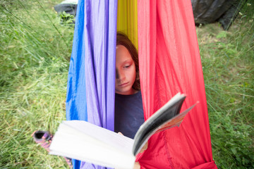 Girl in rainbow hammock