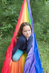 Girl in rainbow hammock