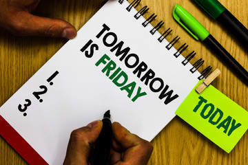 Handwriting text Tomorrow Is Friday. Concept meaning Weekend Happy holiday taking rest Vacation New week Diary pen notepad ring pen marker pointer script daily work handwriting