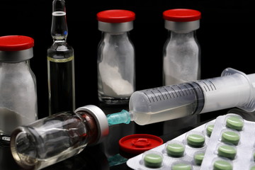 cortisone treatment, syringe and cortisone bottles