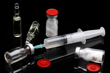 cortisone treatment, syringe and cortisone bottles