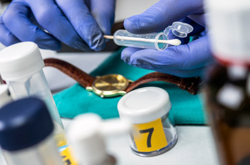 Police scientist working in Criminalistic Lab, victim clock analysis for murder, conceptual image