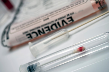 Detail of DNA sampling tubes in Laboratorio forensic equipment, conceptual image