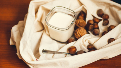 homemade greek yoghurt with walnut and  hazelnut nuts and peach