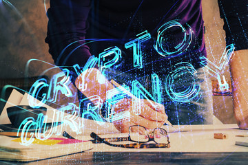 Man's hands working with notes background. Cryptocurrency and finance concept.