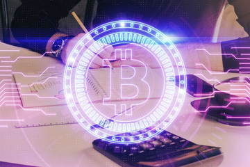 Man's hands working with notes background. Cryptocurrency and finance concept.