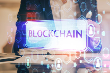 Man's hands working with notes background. Cryptocurrency and finance concept.