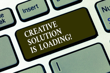 Handwriting text Creative Solution Is Loading. Concept meaning Inspiration Original ideas in process Keyboard key Intention to create computer message pressing keypad idea