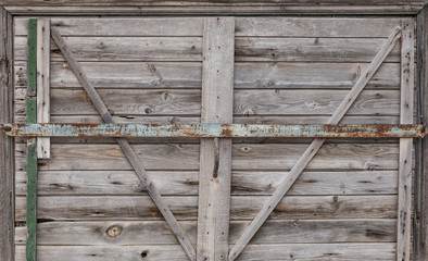 old rustic wooden closed gate © serikbaib