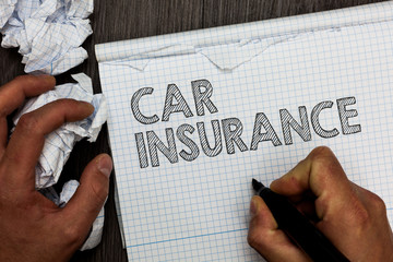 Word writing text Car Insurance. Business concept for Accidents coverage Comprehensive Policy Motor Vehicle Guaranty Man holding marker notebook crumpled papers several tries mistakes made