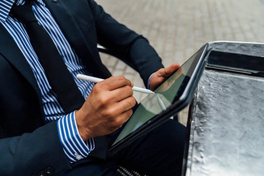 Adult Elegant Indian Businessman Signing a Contract or Taking a