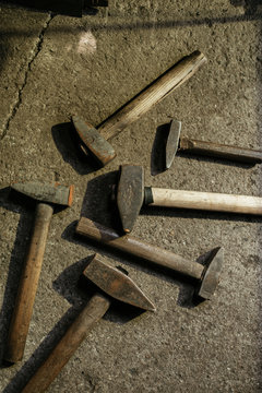 Hammers on concrete background