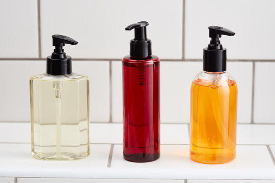 Colorful cosmetics in bottles with pumps