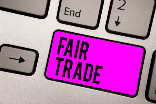 Text sign showing Fair Trade. Conceptual photo Small increase by a manufacturer what they paid to a producer Keyboard purple key Intention create computer computing reflection document
