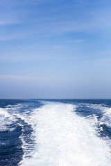 Water splash behind the  speed boat in the ocean
