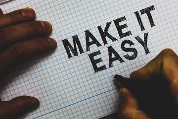 Handwriting text Make It Easy. Concept meaning Smart approach Effortless Free from worries or difficulties Man holding marker communicating ideas important messages squared paper
