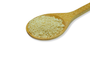 Close-up of Brown cane sugar in wooden spoon isolated on white background.  Organic natural sugar is good for health.