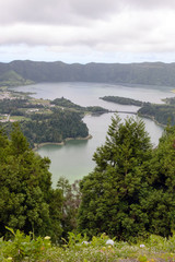 Obraz premium Beautiful views of the twin lake of Seti Sidadish, Lagoa das Sete Cidades in cloudy weather. Panorama. Attractions on the island of San Miguel, Portugal. Travel to the Azores.