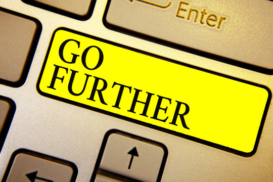 Handwriting text Go Further. Concept meaning To move to a greater distance or overcome your limitations Keyboard yellow key Intention create computer computing reflection document