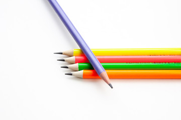 colored pencils in the shape of a star on a white background