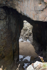 Stone arch in sea cave