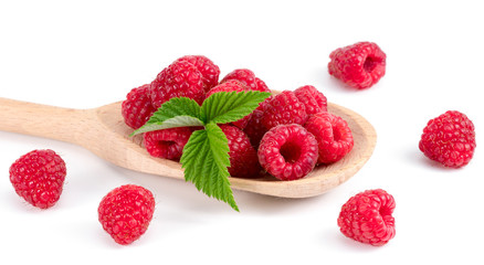 .raspberries on a wooden spoon on a white background