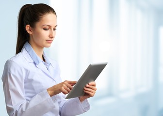 Close-up Doctor at hospital working with tablet pc