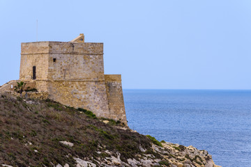Fototapeta na wymiar One of the many fortifications dotted around the coast of Gozo and Malta.