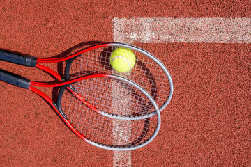 Top view tennis scene with ball and racquet