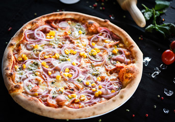 fresh italian pizza with tuna, red onion & corn