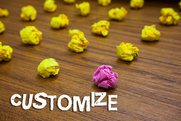 Conceptual hand writing showing Customize. Business photo showcasing modify something to suit particular individual task or demonstrating Lots crumpled papers mistakes not satisfied wooden floor