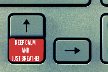 Conceptual hand writing showing Keep Calm And Just Breathe. Business photo text Take a break to overcome everyday difficulties Keyboard Intention to create computer message keypad idea