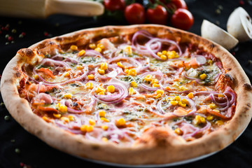 fresh italian pizza with tuna, red onion & corn