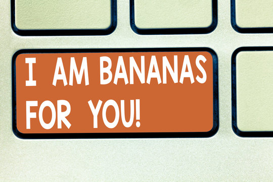 Text sign showing I Am Bananas For You. Conceptual photo To be crazy for someone in loved happy emotion Keyboard key Intention to create computer message pressing keypad idea