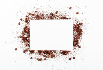 Ground coffee and beans on white background.