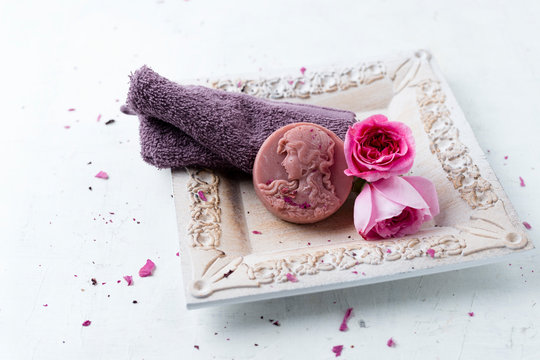 Homemade rose soap, flower and washcloth