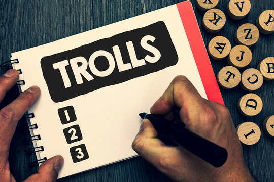 Writing note showing Trolls. Business photo showcasing Online troublemakers posting provocative inflammatory messages Creative idea paper object inspiration lovely thoughts puzzle notepad