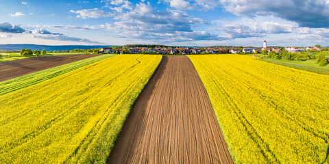 Aerial view over rape fields near Schlichten, Swabian Franconian forest, Germany