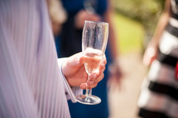 Wedding celebration holding a glass of Champaign 