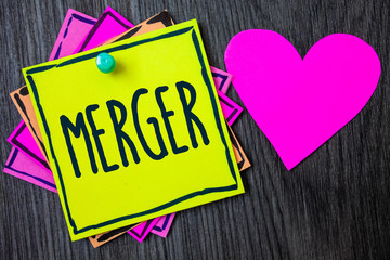Handwriting text writing Merger. Concept meaning Combination of two things or companies Fusion Coalition Unification Border sticky remember cards love heart pinned dark woody background