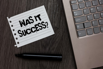 Word writing text Was It Success Question. Business concept for Happy feeling after achieving success in life Laptop nice computer notebook netbook pen small pitch paper pen wood