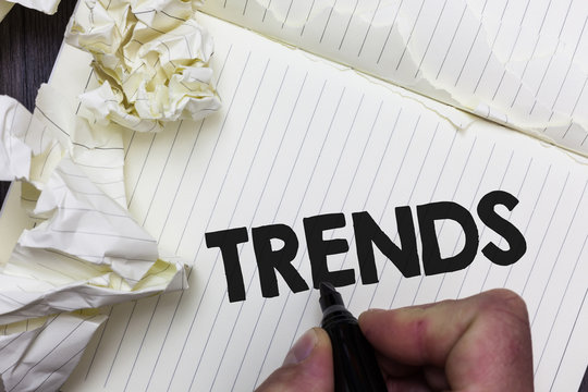 Conceptual hand writing showing Trends. Business photo showcasing General projected directions of something according to time Paper object notepad crumpled papers ideas several tries