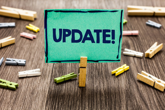 Text sign showing Update Motivational Call. Conceptual photo Up to date with latest developments updated Random clips art work board creative nice paperclips wood grey shadow